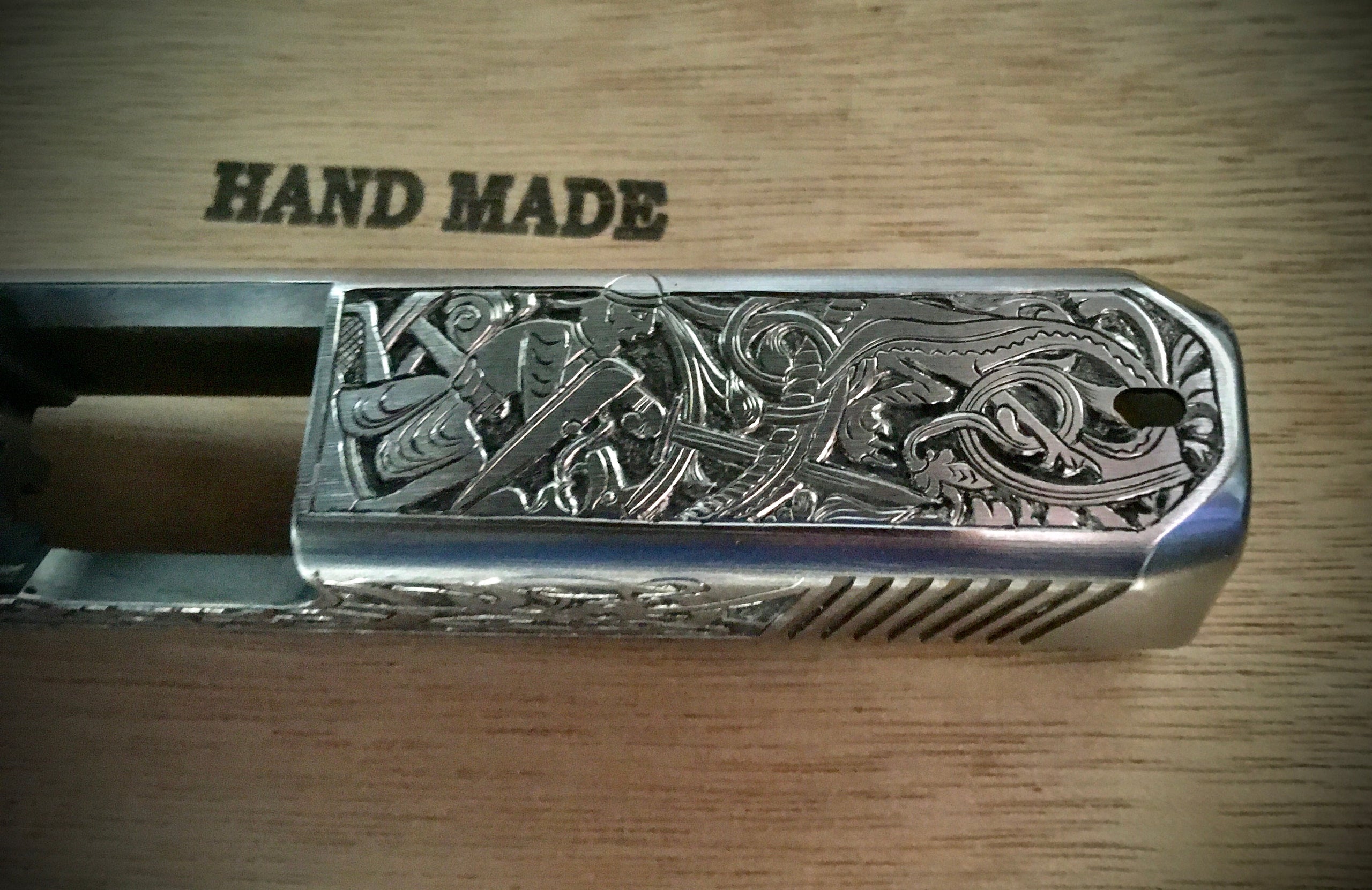 Hand engraved Glock slide Custom Engraving on guns and knives