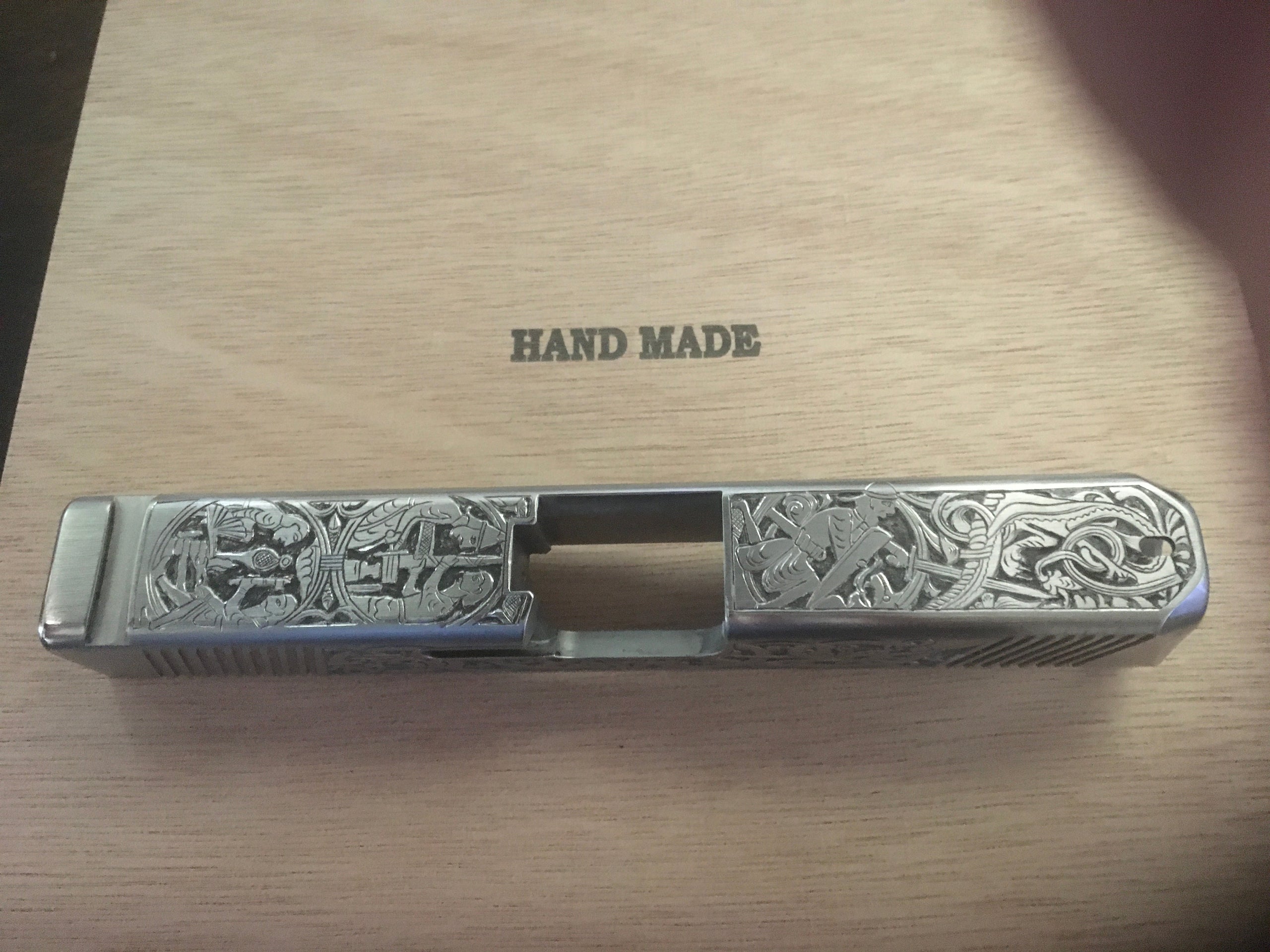 Hand engraved Glock slide Custom Engraving on guns and knives